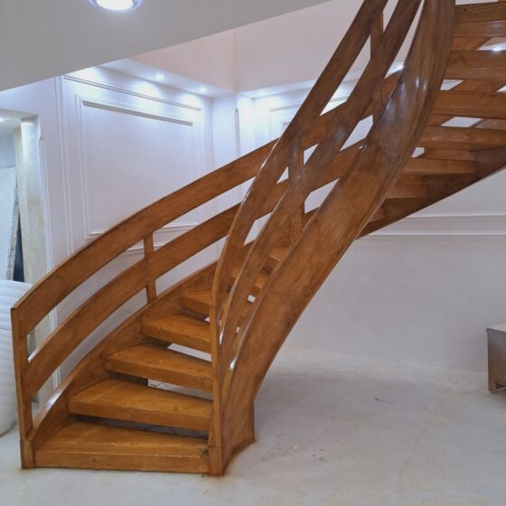 Bespoke timber spiral staircase with elegant curved handrails