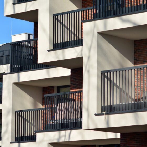 Multiple steel balconies on modern apartment building façade