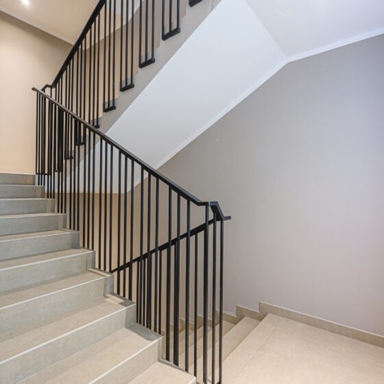 Black steel balustrade on modern apartment staircase