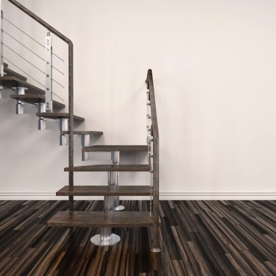 Close-up view of floating staircase with precision steel welds and timber treads