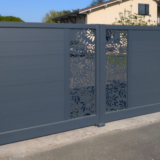 Dark grey metal gate with modern laser-cut decorative panels