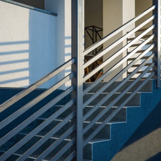 Exterior staircase with sleek horizontal bar steel balustrade