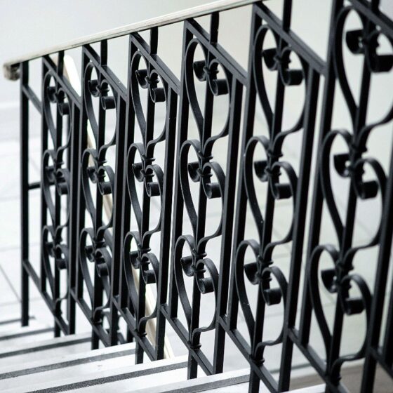 Ornamental wrought iron balustrade with heart-shaped patterns for staircase