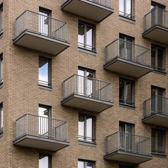 Cluster of residential steel balconies on multi-storey building