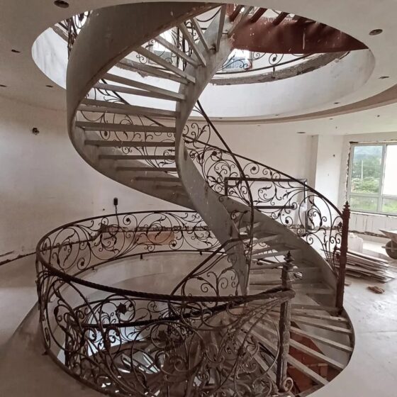 Spiral staircase under construction with ornate wrought-iron balustrade — Staired project, London