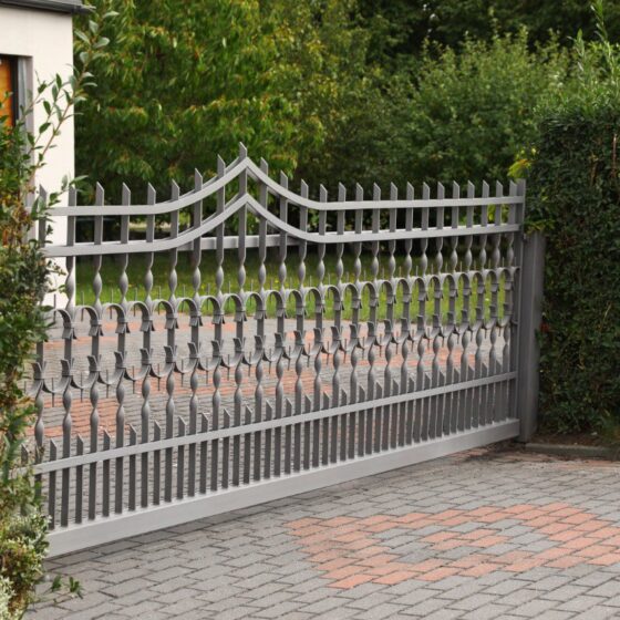 Ornamental wrought iron gate with bespoke pattern for driveway entrance