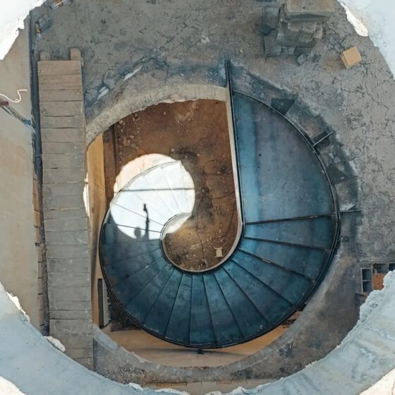 Top-down view of spiral steel staircase during build